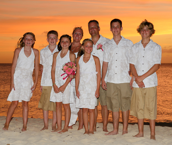 Wedding party of nine in red Birds of Paradise prints